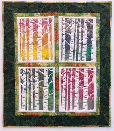 three quilted squares with trees in different colors and sizes, each showing the same pattern