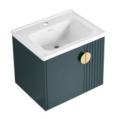 a white sink sitting next to a green cabinet