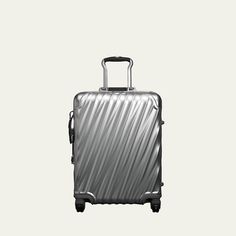 Carry-on made of aluminum. 16"W x 9"D x 22"T. Imported. Silver Rectangular Luggage With Sleeve, International Carry On Luggage, Carry On Luggage, Push Button, Bergdorf Goodman, Travel Luggage, Carry On, Zip Pockets, Tops Designs