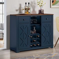 a blue cabinet with wine glasses and bottles on top