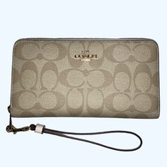 Nwt Coach - Signature Canvas Long Zip Around Wallet In Im / Light Khaki / Chalk Color W/ Wristlet Strap -This Exact Color Combination Not Available On Coach Website -The Stock Photos / Last Two Pictures Are From A Coach Website. Per Coach Website: Length: 7.5" Height: 4.0" Width: 1.0" -Detachable Wrist Strap -Inside Zip Coin Pocket -12 Credit Card Slots (6 On Each Side) -Full-Length Bill Compartments Elegant Handheld Wallets For Daily Use, Elegant Handheld Wallet For Daily Use, Elegant Handheld Travel Wallets, Elegant Handheld Travel Wallet, Elegant Handheld Wallets With Card Slots, Elegant Handheld Wallet With Card Slots, Elegant Rectangular Wallets For On-the-go, Handheld Wallets As Gifts, Designer Beige Wallet For Daily Use