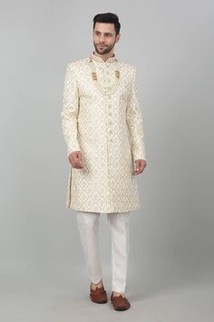 Ivory cotton sherwani with all over Mughal ogee pattern, thread embroidery, cut dana, zari and bead work mandarin collar. Paired with kurta and straight fit pant. - Aza Fashions Festive Off White Sherwani With Resham Embroidery, Festive Off White Sherwani With Intricate Embroidery, Traditional Beige Sherwani With Chikankari Embroidery, Off White Straight Kurta Sherwani For Festive Occasion, Off White Sherwani With Resham Embroidery For Diwali, Off White Bandhgala With Zari Work Traditional Drape, Off White Sherwani With Chikankari Embroidery For Transitional Season, Festive Off White Sherwani With Straight Kurta, Cream Embroidered Sherwani With Straight Kurta