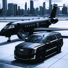 a black suv parked next to an airplane on the tarmac