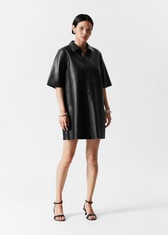 Short-sleeve leather dress in a smooth finish. Detailed with a centre front zipper.Length of dress:83cm / 32.7" (Size S) Prom Ball Gown, Knit Outerwear, Linen Sweater, Leather Mini Dress, Popular Outfits, Swimsuit Fashion, Fashion Story, Leather Dress, Swimwear Fashion