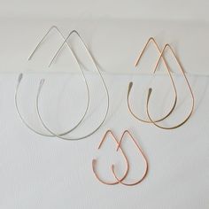 "Looking for a pair of hoops that you can wear everyday, looks great at work and play? My hoop collection is made with sterling silver, 14k gold fill or rose gold fill, no plated materials, these will last a lifetime and the craftsmanship is guaranteed for life. So lightweight, you won't even know they are there. I am pretty confident that there is a style and size that fits Your style!! Returns welcome if not fully satisfied. Find Your Pair Today! Free Shipping and Free Returns! Medium Teardrop Minimalist Drop Hoop Earrings With Ear Wire, Everyday Teardrop Threader Earrings, Minimalist Teardrop Hoop Earrings For Everyday, Minimalist Teardrop Hoop Earrings With Ear Wire, Everyday Rose Gold Teardrop Hoop Earrings, Hoop Earrings Medium, Trio Necklace, Threader Earrings Gold, Earrings Gold Hoop