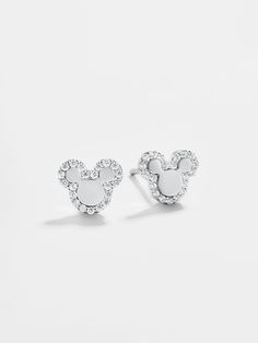 The perfect dainty Disney pairing, the Disney Sterling Silver studs feature a silver metal Mickey Mouse outline with a gorgeous pavé border. Mouse Outline, Mickey Mouse Outline, Mickey Mouse Silhouette, Mouse Earrings, Disney 2024, Disney Bracelet, Mickey Mouse Earrings, Disney Jewelry, Jewelry Inspo