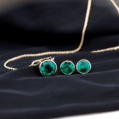 Product Details Introducing our exquisite Solitaire Jewelry Set, a perfect expression of eternal love for the most special woman in your life. This set includes a stunning pendant and earring duo, both adorned with captivating Round Cut Created Emerald gemstones in Bezel Setting. Product Information SKU SHP-PENDANT042168623 Weight 5.36 gm (Approximate) LAB CREATED EMERALD INFORMATION No.of Stones 3 Pieces Total Weight 7.86 Carat (Approximate) Dimension(approx) Round-10X10 mm-1 PcsRound-8X8 mm-2 Lab Created Emerald, Emerald Gemstone, Eternal Love, Bezel Setting, Jewelry Set, Round Cut, Emerald, White Gold, Yellow Gold