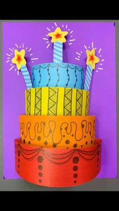 an image of a birthday cake made out of paper on top of a purple background