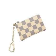 a checkered purse with a keychain hanging from the front, on a white background