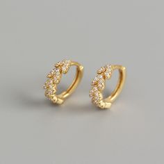 Experience the elegant simplicity of our 18K Vermeil Dainty Arrow CZ Huggies. Made with 18k gold over genuine 925 sterling silver and delicate cubic zirconia, these hypoallergenic earrings are perfect for everyday wear. Additionally, their water resistant design adds convenience and peace of mind. Elevate your look with these minimalist huggies today! Also available in Silver. Heart Leaf, Earrings White, Hypoallergenic Earrings, White Earrings, Everyday Earrings, Circle Earrings, Sterling Silver Heart, Fashion Mode