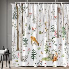 a shower curtain with animals and trees in the woods on it's white background