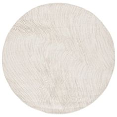 a white circular rug with wavy lines on the top and bottom, against a white background