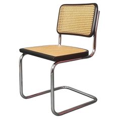 a chair with a woven seat and metal frame