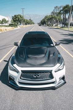 the front end of a car parked in a parking lot