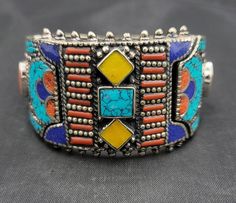 It's Beautiful Handmade Authentic Silver Bangle Bracelet With Natural Turquoise Stone Coral And Lapis Lazuli And Yellow Copal it's Beautiful Handmade Silver Bangle Bracelet Material Silver Gemstone Turquoise Coral And Lapis Lazuli Size 7Cm Blue Southwestern Handmade Bangle, Southwestern Style Blue Bangle Bracelets, Southwestern Style Blue Bangle Bracelet, Turquoise Bracelet For Festivals, Turquoise Bracelet For Festival, Bohemian Turquoise Bangle For Festivals, Blue Bracelet Jewelry For Festivals, Southwestern Adjustable Jewelry For Festivals, Adjustable Multi-stone Cuff Bracelet Gift