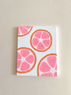 an orange and pink painting on a white wall