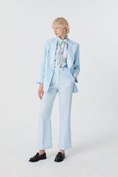 The All Heart Linen Blazer is a playful take on classic tailoring, featuring one-of-a-kind lapels with bold, heavy stitch edging for a distinctive touch. This relaxed boyfriend-style blazer is fully lined with a breathable linen-cotton blend, ensuring all-day comfort. Thoughtful details like front welt pockets and a back vent make this piece effortlessly versatile for any occasion. Regular fit silhouette. Model is wearing a Size AU 8 Pale Blue Trousers Outfit, Pale Blue Suit, Blue Trousers Outfit, Ladies Trouser Suits, Light Blue Suit, Classic Tailoring, Garment Care Labels, Waterproof Pants, Style Blazer