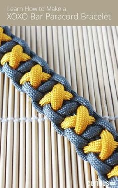 a close up of a piece of fabric with yellow and blue braiding