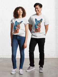 two people standing next to each other wearing t - shirts with an image of a tiger on it