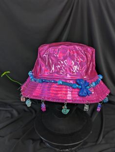 -hat color - pink -bead color -blue -charm color - blue and pink -unisex adult size -inner circumference - 22.5in -crown dip - 3in -brim - 2.25in -NOT machine washable -Perfect for raves and outdoor festivals! Shipping within the US USPS First Class Package 3-9 days USPS Priority Mail 1-5 days USPS Priority Mail Express 1-3 days Shipping International  USPS First Class Mail International  -Varies- USPS Priority Mail International 6-14 days USPS Priority Mail Express International 3-9 days Shipping times are estimated, NOT GUARENTEED.  +International buyers are responsible for all import fees+ +Orders of $50+ may require signature confirmation upon delivery+ Blue Charm, Pink Beads, Bucket Hats, Blue And Pink, Priority Mail, Caps Hats, Bucket Hat, Accessories Hats, Blue White