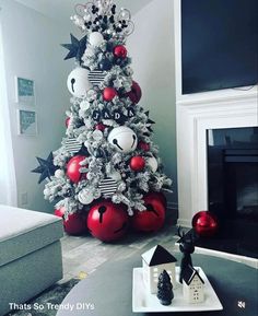 a christmas tree decorated with black and white ornaments