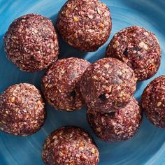 a blue plate topped with chocolate balls on top of a table