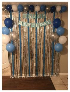 a birthday decoration with balloons and streamers