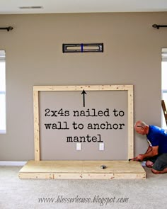 a man is working on a sign in the middle of a room with ladders