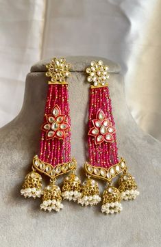 Step into a world of regal opulence with our exquisite Royal hot pink and gold Kundan Earrings. .

The harmonious blend of these majestic colors creates a captivating display of opulence and elegance. The golden framework enhances the allure, highlighting the meticulous attention to detail.

Wearing these earrings will instantly transport you to a realm of sophistication and grace. Whether it's a grand celebration, a special occasion, or an evening soiree, these earrings will elevate your look and make you feel like royalty. They are designed to catch the light and reflect your inner radiance. Gold Kundan Earrings, Hot Pink And Gold, Kundan Earrings, Ethnic Fashion