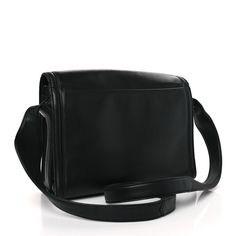 This is an authentic CHANEL Lambskin CC Shoulder Bag in Black. This stylish shoulder bag is crafted of luxuriously soft lambskin leather. The bag features a waist length leather shoulder strap and a facing flap with a quilted Chanel CC logo and a long black leather. The flap opens to a spacious black fabric interior. Stylish Shoulder Bag, Shoulder Bag Black, Cc Logo, Waist Length, Long Black, Lambskin Leather, Black Fabric, Shoulder Strap, Black Leather