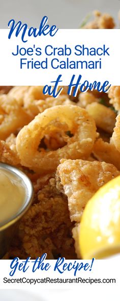 fried calamari with dipping sauce and lemon wedges on the side for an appetizer