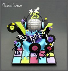 a birthday cake decorated with musical instruments and stars on it's top is the number twenty five