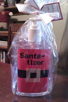 a bottle of santa - tizer sitting on top of a table