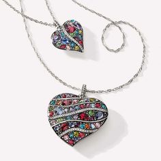 Between undulating lines of pave-set clear Swarovski, colorful crystals in myriad shapes and sizes create a brilliant mosaic. Multicolor Rhinestone Cubic Zirconia Jewelry, Multicolor Cubic Zirconia Rhinestone Jewelry, Multicolor Sparkling Crystal Jewelry, Sparkling Multicolor Crystal Jewelry, Multicolor Rhinestone Jewelry For Anniversary, Multicolor Crystal Pendant Jewelry, Multicolor Rhinestone Anniversary Jewelry, Trust Your Journey, Handbag Care