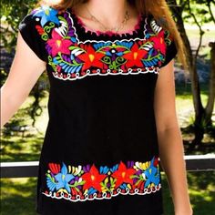 Absolutely Beautiful Top Made In Mexico With Multicolor Floral Embroidery. Silk Thread Over Cotton Fabric. Machine Embroidered Which Makes It Suitable For Machine Wash And Dry. Very Comfortable Fit, True To Size. The Colors Of Embroidery May Vary Depending On Stock Black Cotton Top With Geometric Embroidery, Black Cotton Blouse With Geometric Embroidery, Black Cotton Folk Embroidered Top, Black Cotton Tops With Geometric Embroidery, Traditional Embroidered Black Tops, Casual Black Embroidered Top With Geometric Design, Casual Black Blouse With Geometric Embroidery, Black Crew Neck Blouse With Floral Embroidery, Casual Black Top With Geometric Embroidery