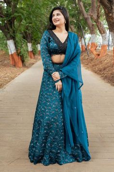 Teal green attached cancan lehenga with all over floral print and hand embroidered glass beads on waist. Paired with a printed padded blouse with placed hand embroidery and dupatta with matching hand embroidery. - Aza Fashions Festive V-neck Lehenga With Dupatta, Festive V-neck Lehenga With Zari Work, Festive V-neck Lehenga With Resham Embroidery, Anarkali Style Lehenga With V-neck And Resham Embroidery, Festive Semi-stitched Lehenga With V-neck, Festive Semi-stitched V-neck Lehenga, Designer Bollywood Lehenga With V-neck, Festive Resham Embroidery V-neck Lehenga, Bollywood Style Lehenga With V-neck Dupatta