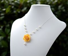 "Featuring Hand sculpted Golden Yellow Rose and Pearls Drop Necklace. If you prefer different type of yellow as seen in the last picture, please drop a note or convo me. Variety Yellow Jewelry sets available in my shop. * Hand Sculpted Rose . Size approx : 25-26mm across. * 8mm White Pearls (Pictured). Glass Pearls and Swarovski pearls available. * Silver Plated Chain (pictured) . Antiqued Brass and Gold Plated chain available, please drop a note or convo me if you interested. * The entire lengt Yellow Flower Pendant Necklace For Weddings, Yellow Flower Necklace, Yellow Bridesmaid, Pink Dogwood, Pearl Drop Necklace, Yellow Bridesmaids, Yellow Jewelry, Yellow Springs, Rose Necklace