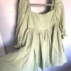 Beautiful Baby Doll Dress. Sage Green Color With White Pin Strip Design. Dress Is Fully Lined. Material Wrinkles Easy Last Picture Is To Show The Style And Fit (Not The Design/Color). Other Dress From Same Boutique. Too Large For Me (Typically Size Medium 6-8, Small Chested) And Can’t Return, But Never Worn. Green Summer Mini Dress With Puff Sleeves, Green Flowy Mini Dress With Square Neck, Green Puff Sleeve Cotton Mini Dress, Green Cotton Puff Sleeve Mini Dress, Green Cotton Mini Dress With Puff Sleeves, Cute Green Mini Dress For Brunch, Cute Green Square Neck Dress, Cute Green Dress For Brunch, Green Flowy Cotton Mini Dress