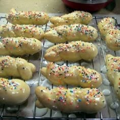 bread sticks with sprinkles are cooling on a rack