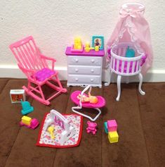 a doll house with furniture and accessories on the floor