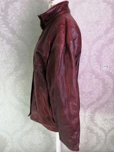 "Vintage 80s mahogany red Leather autumn coat, large jacket. Swedish Masens scandinavian motorcycles hipster, punk, goth clothes. Large sleeves. Unisex, women`s real leather jacket. Frontal buttons and zipper. 2 sides pockets. 1 inside slip pocket. Short sides belts with rivets (2 various sizes can make). Punk style, hipster. Made in Sweden. Dry leather cleaning only! brand: Masens Shinnindustri material of outer: genuine leather. Textile lining. condition: the jacket is in good condition. A lit Vintage Burgundy Outerwear For Fall, Oversized Burgundy Outerwear For Winter, Leather Jacket Trench Coat, Retro Burgundy Long Sleeve Outerwear, Oversized Burgundy Winter Outerwear, Red Vintage Leather Jacket For Streetwear, Vintage Red Leather Jacket, Red Leather Outerwear With Pockets, Vintage Red Leather Outerwear