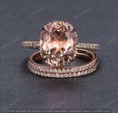 an engagement ring and wedding band set with a large peach morganite in the center