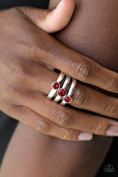 A trio of red rhinestones slant across three stacked silver bands, coalescing into a refined centerpiece. Features a stretchy band for a flexible fit.

 Sold as one individual ring. Paparazzi Accessories Jewelry, Silver Bands, Refined Fashion, Red Ring, Red Rings, Rhinestone Ring, Ring Sale, Paparazzi Accessories, Matching Accessories