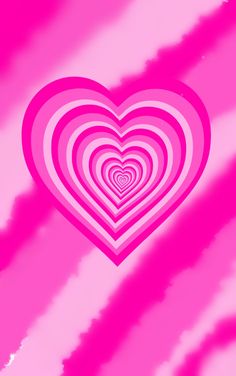 a heart shaped object in the middle of pink and white stripes