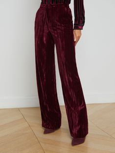 The L’AGENCE favorite straight-leg trouser, fitted through the hips and relaxed through the leg. Reinvented each season in fresh prints and fabrications. • Crinkle effect velvet fabric• High-rise wide straight-leg• Side slant pockets• Back welt pockets• Hidden hook-and-bar closure | L'AGENCE Livvy Velvet Trouser In Dark Port Velvet Resort Accessories, Rococo Sand, Velvet Trousers, Straight Trousers, Denim Shoes, Denim Coat Jacket, Straight Leg Trousers, Denim Flares, Fall Shopping