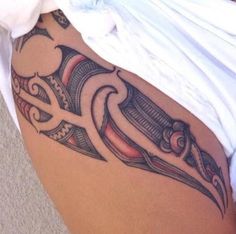 a close up of a person's stomach with an artistic tattoo design on it