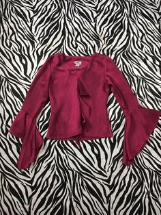 "90s Vintage Bell Sleeve Ruffle Blouse in Shiny Deep Magenta Color I'm in love with this beautiful, romantic style magenta blouse! Ruffle accent down the front and flowy bell sleeves. Reminds me of a medieval style sleeve. Gorgeous deep purple, magenta jewel tone color. The fabric is a polyester but has a sheen to it like a polyester taffeta. This color photographs as a red wine tone but in real life there's a little more purple in it. Made in USA Brand: J.B.S. Ltd Tag Size: Small Measurements ( Magenta Blouse, Frilled Sleeves, Clothes Combinations, Deep Magenta, Magenta Color, Medieval Style, Vintage Bell, Medieval Fashion, Design Clothes