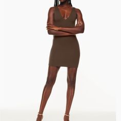 This Is A Mini Dress With A V Neckline In The Front And Back. It’s Made With Babaton’s Signature Contour Luxe, Ultra-Flattering Fabric Coveted For Its Smoothing Effect And Second-Skin Feel. Essential For Every Body. Double-Layer Fabric Materials & Care Content: 94% Nylon, 6% Elastane Care: Machine Wash Imported Tight A Close Fit That Hugs The Body Length: Mini Intended To Hit Between Mid Thigh And Low Thigh A Size Xs Will Fit Someone Who Typically Wears A 0 In Other Aritzia Clothing. Depending O Fitted V-neck Brown Bodycon Dress, Brown Fitted V-neck Bodycon Dress, Stretch Brown V-neck Bodycon Dress, Brown Stretch V-neck Bodycon Dress, Stretch Brown V-neck Midi Dress, Brown Stretch V-neck Midi Dress, Brown V-neck Bodycon Dress, Brown Bodycon V-neck Dress, Casual V-neck Bodycon Mini Dress