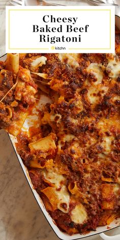 cheesy baked beef rigatoni in a white casserole dish with text overlay