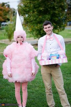 a man and woman are dressed up as pink poodles for a costume party